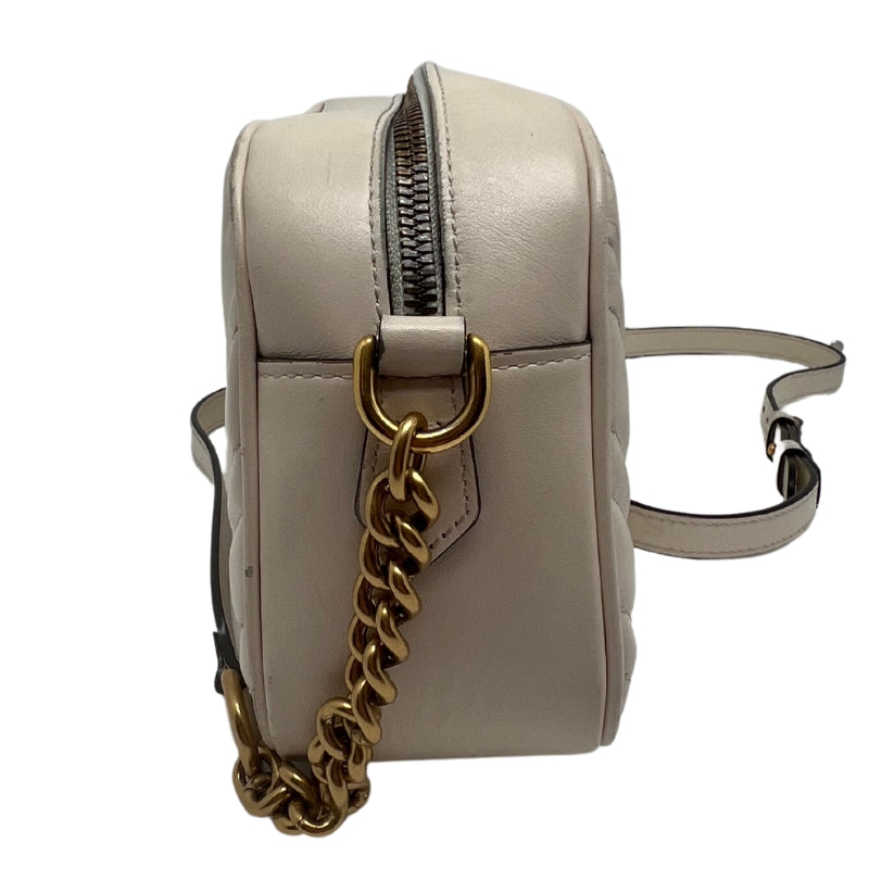 Side View: White Chevron Leather with GG on the Back, Gold-Tone Hardware, Double G, Adjustable Shoulder Strap, Zip Closure.
