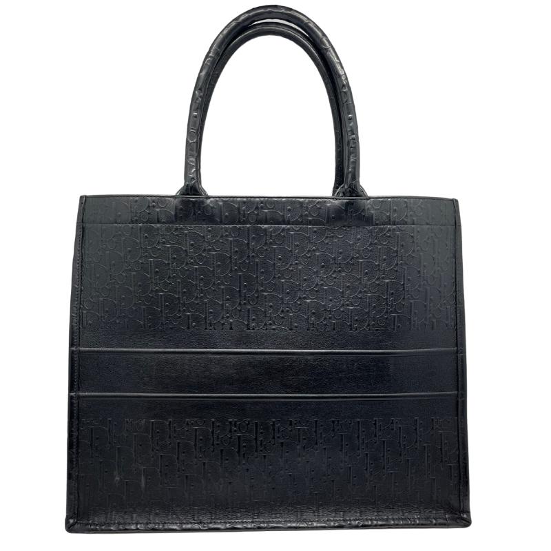 Dior leather oblique embossed book tote, black embossed dior logo exterior, christian dior across front, dual rolled handles, open top, suede lining, condition excellent, back view