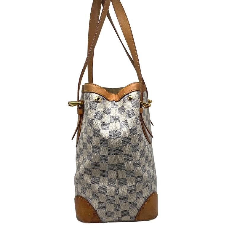 Louis Vuitton damier azure hampstead tote, brass hardware, dual adjustable shoulder straps, clasp closure at top, checker print coated canvas exterior, alcantara lining, felt insert, three interior pockets, condition excellent, side view