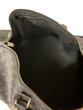 Louis Vuitton Monogram Eclipse Keepall | Coated Canvas | Cowhide Leather Trim | Double Zip Closure | Removable ID Holder | Adjustable, Removable Strap | Double Handles | Interior Zip Pocket | Padlock & Keys | Excellent Condition | Dust Bag Included