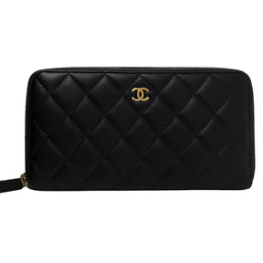 Front View: Diamond Quilted Lambskin Leather, Small Chanel CC Logo in Gold, Silver Zipper. 