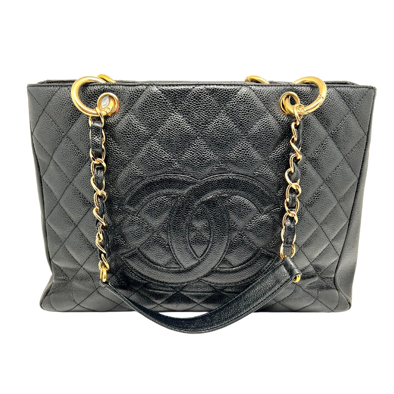 Front view: Quilted Caviar Leather in Black. Prominent Quilted Chanel CC Logo. Threaded Gold Chain-Link Shoulder Straps. 