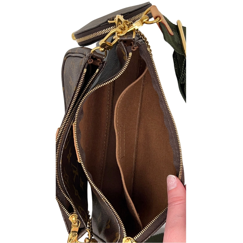 Interior View: Louis Vuitton Multi Pochette Hybrid Crossbody Bag. Gold-Toned Hardware. Zip Closure at Top. 