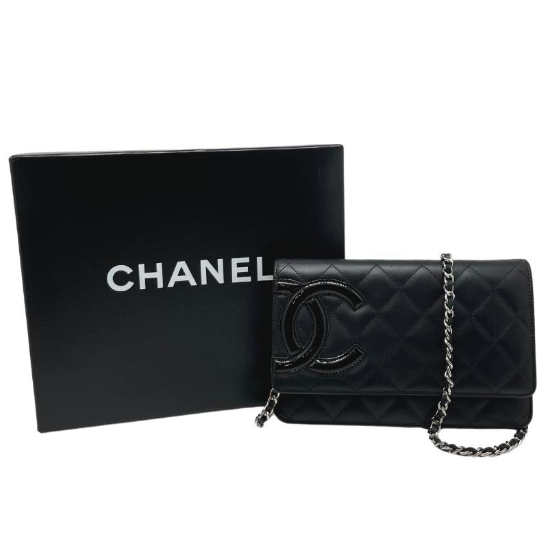 Chanel ligne cambon wallet on chain, quilted black leather exterior, patent CC logo detail, silver hardware, chain shoulder strap, snap closure at front, hot pink cc logo lining, dual interior pockets with card slots, condition excellent, front view