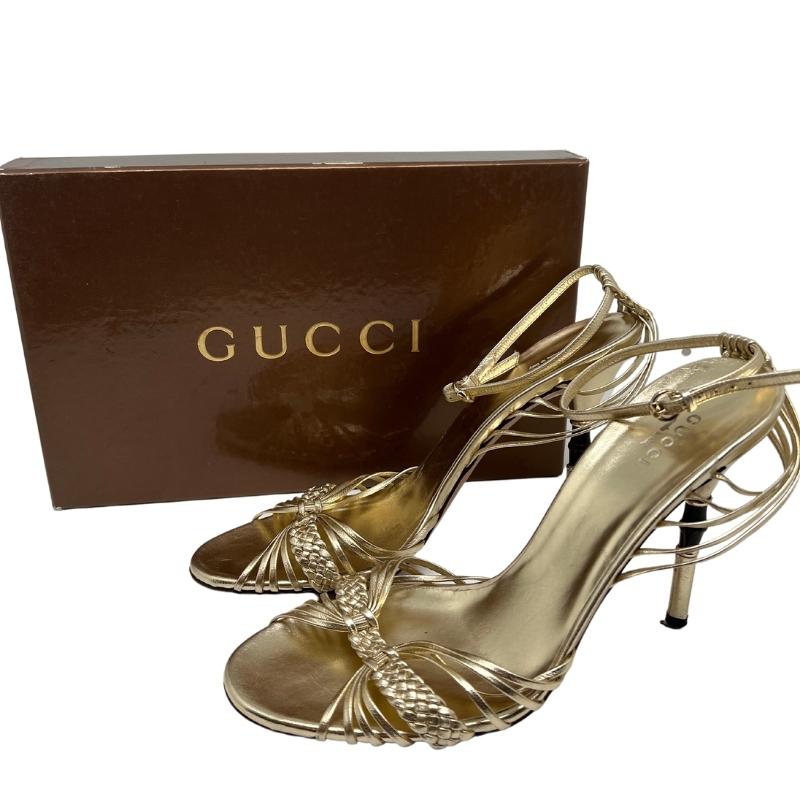 Gucci Braided Platino Sandal, Gold Metallic Leather, Interlocking G Chain Hardware, Handmade Braided Detail, Leather Sole, Adjustable Ankle Strap, High Heel, Size: 8.5. Condition: Excellent. 