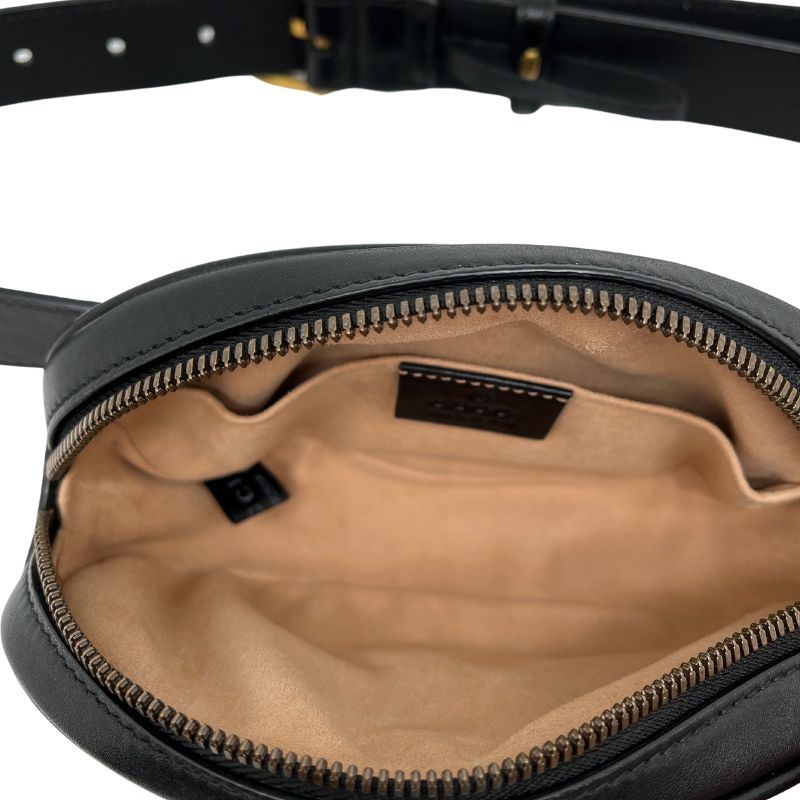 Gucci Mini Matelasse GG Marmont Belt Bag in black leather with gold tone hardware, adjustable waist strap, suede lining, and single interior pocket. Excellent condition