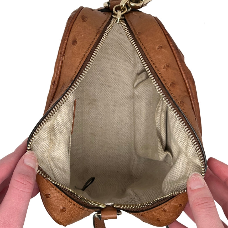 Interior View: Linen Lining, Two Pockets in Interior, Zip Closure. 