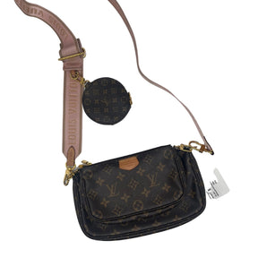 Louis Vuitton Monogram Multi Pochette Accessoires Bag Brown Monogram Pattern Brass Hardware Leather Trim Dual Shoulder Straps - Light Pink Canvas Lining & Dual Interior Pockets Zip Closure at Top Includes Coin Purse