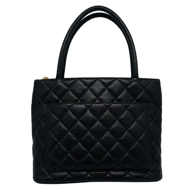 Chanel Caviar Medallion Tote, Quilted Leather Exterior, Gold Tone Hardware, Rolled Handles, Chain Link Accents, Single Exterior Pocket, Leather Lining, Dual Interior Pockets, Zip Closure at Top, Condition: Excellent