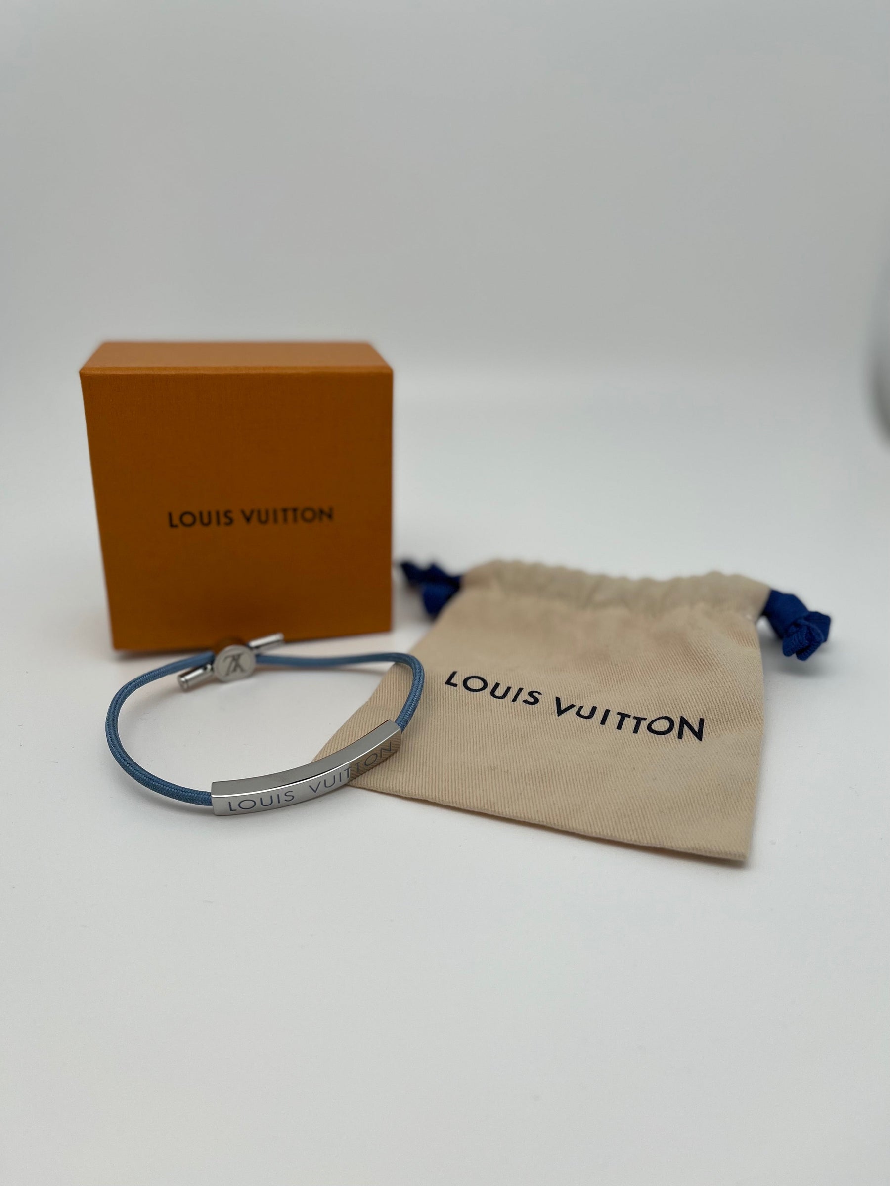 Louis Vuitton Space Bracelet | Palladium-Plated & Brass | Light Blue Cord | Adjustable | Excellent Condition | Box & Jewelry Pouch Included