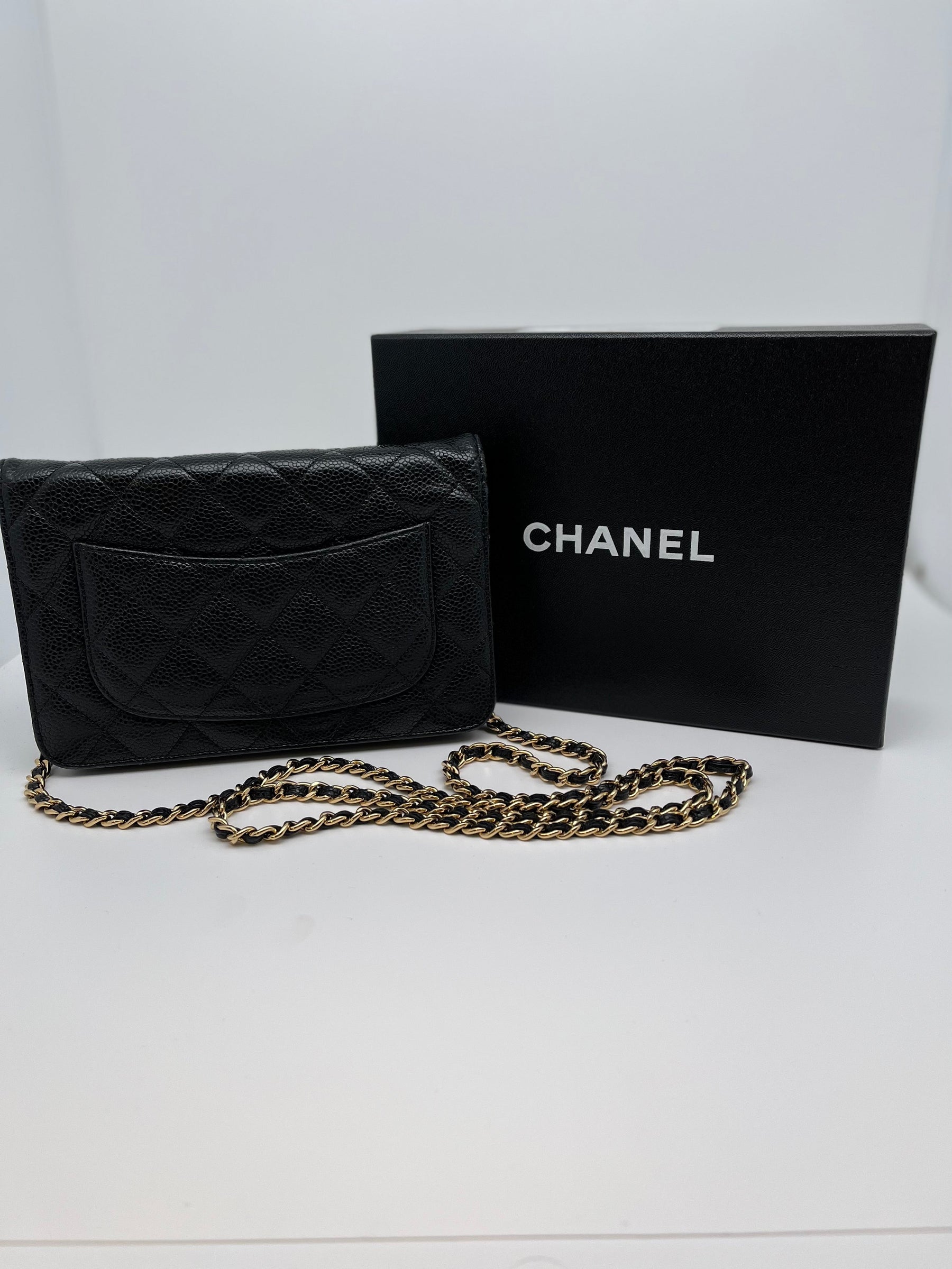 Classic Chanel Wallet on Chain | Black Quilted Leather | Gold Tone Hardware | Snap Front Closure | Chain Link Strap | Leather Lining | Burgundy Interior | Single Exterior Pocket | Interior Zippered Pocket & 6 Card Holders | Great Condition | Box Included