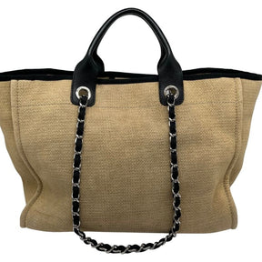 Chanel Deauville Canvas Tote with black leather lining, flat handles and chain link shoulder straps. Excellent condition