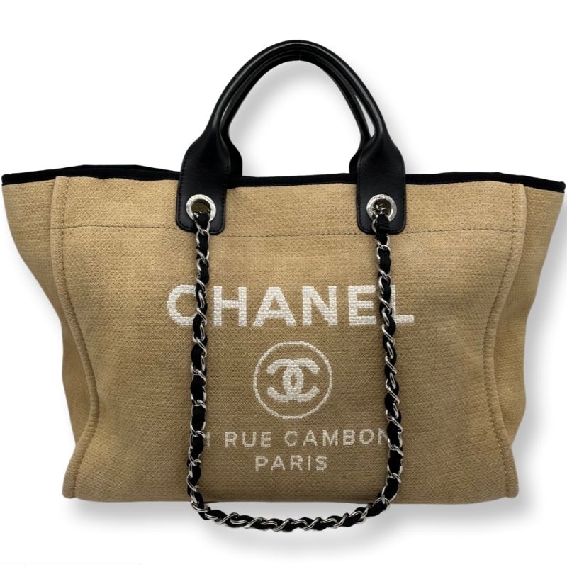 Chanel Deauville Canvas Tote with black leather lining, flat handles and chain link shoulder straps. Excellent condition