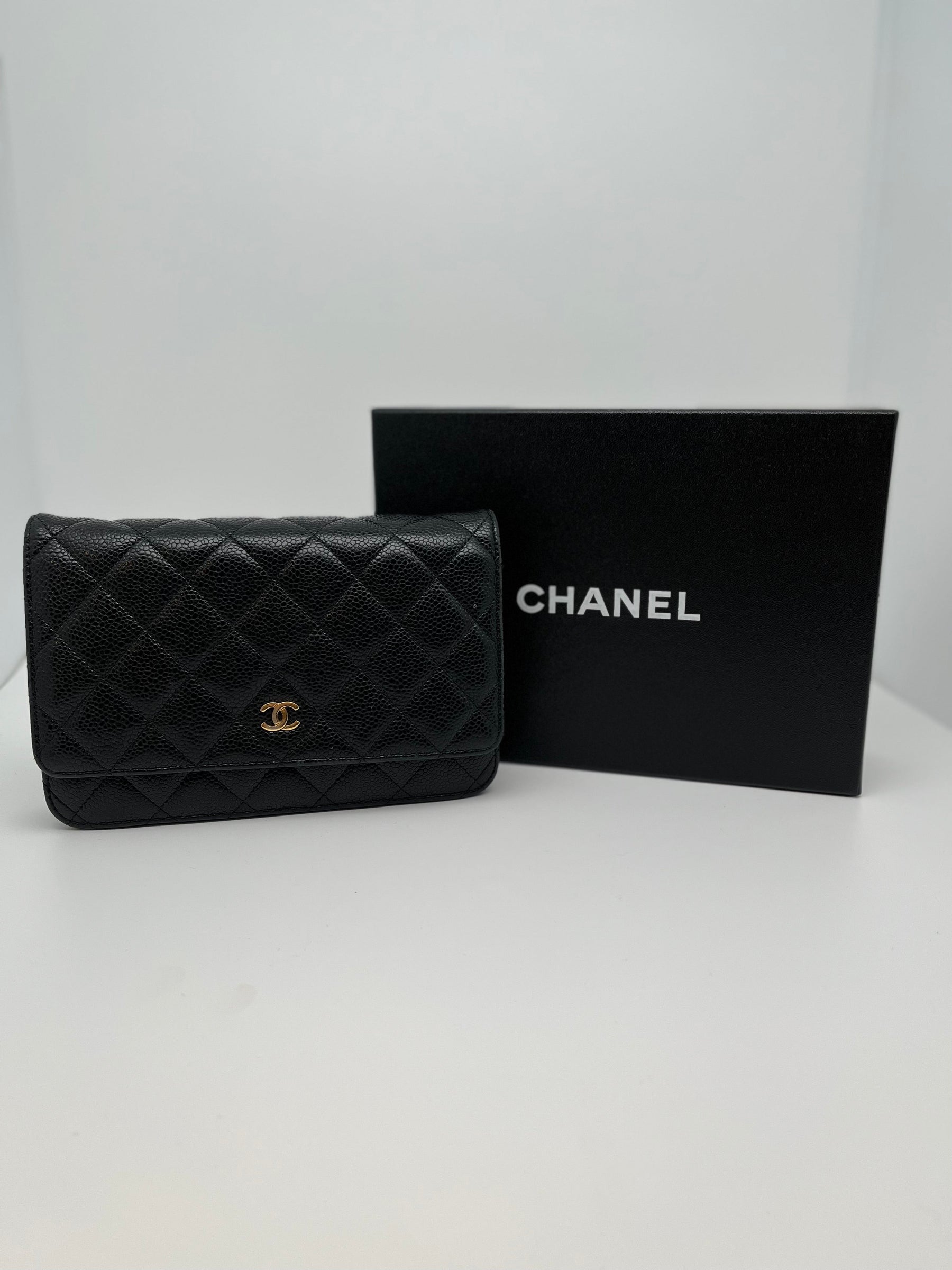 Classic Chanel Wallet on Chain | Black Quilted Leather | Gold Tone Hardware | Snap Front Closure | Chain Link Strap | Leather Lining | Burgundy Interior | Single Exterior Pocket | Interior Zippered Pocket & 6 Card Holders | Great Condition | Box Included