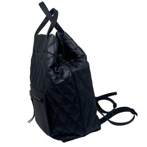 Givenchy rubberized canvas quilted duo backpack, black quilted exterior, gold hardware, front zipper pocket, adjustable and removable backpack straps, dual top handles, single interior pocket, clasp closure at top, condition excellent, side view