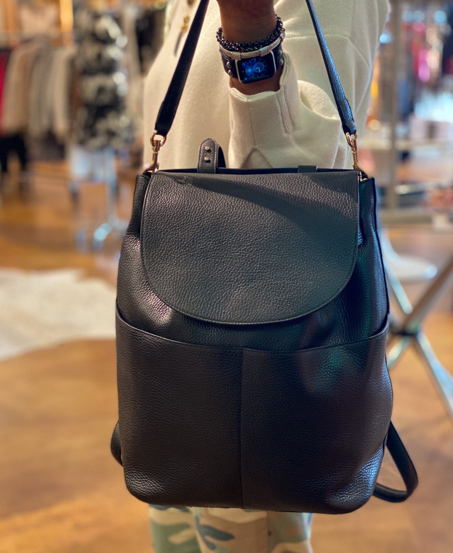 Cuyana Leather Backpack model holding