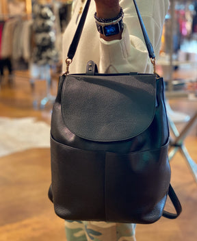 Cuyana Leather Backpack model holding