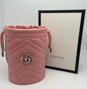 Pink Leather Gucci Marmont Matelassé Bucket Bag | Silver-Tone Hardware | Chain Link Shoulder Strap | Suede Lining | Leather Card Slots | Drawstring Closure | Box & Dust Bag Included | Excellent Condition