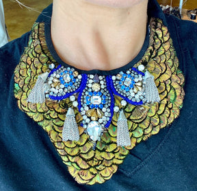 necklace on with peacock and blue details