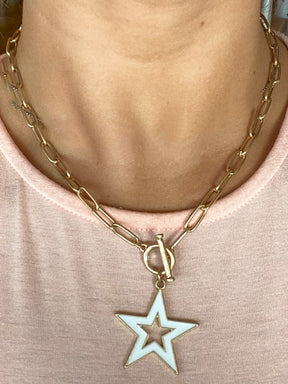 white star necklace on