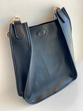 black ahdorned messenger bag