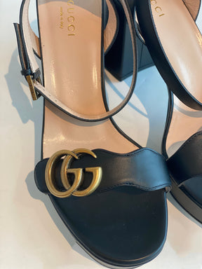 gg gold gucci black pumps