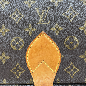 Louis Vuitton Monogram Cartouchière with brown monogram leather, adjustable shoulder strap, and buckle closure at front. Good condition with some signs of wear