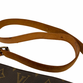 Louis Vuitton Monogram Cartouchière with brown monogram leather, adjustable shoulder strap, and buckle closure at front. Good condition with some signs of wear