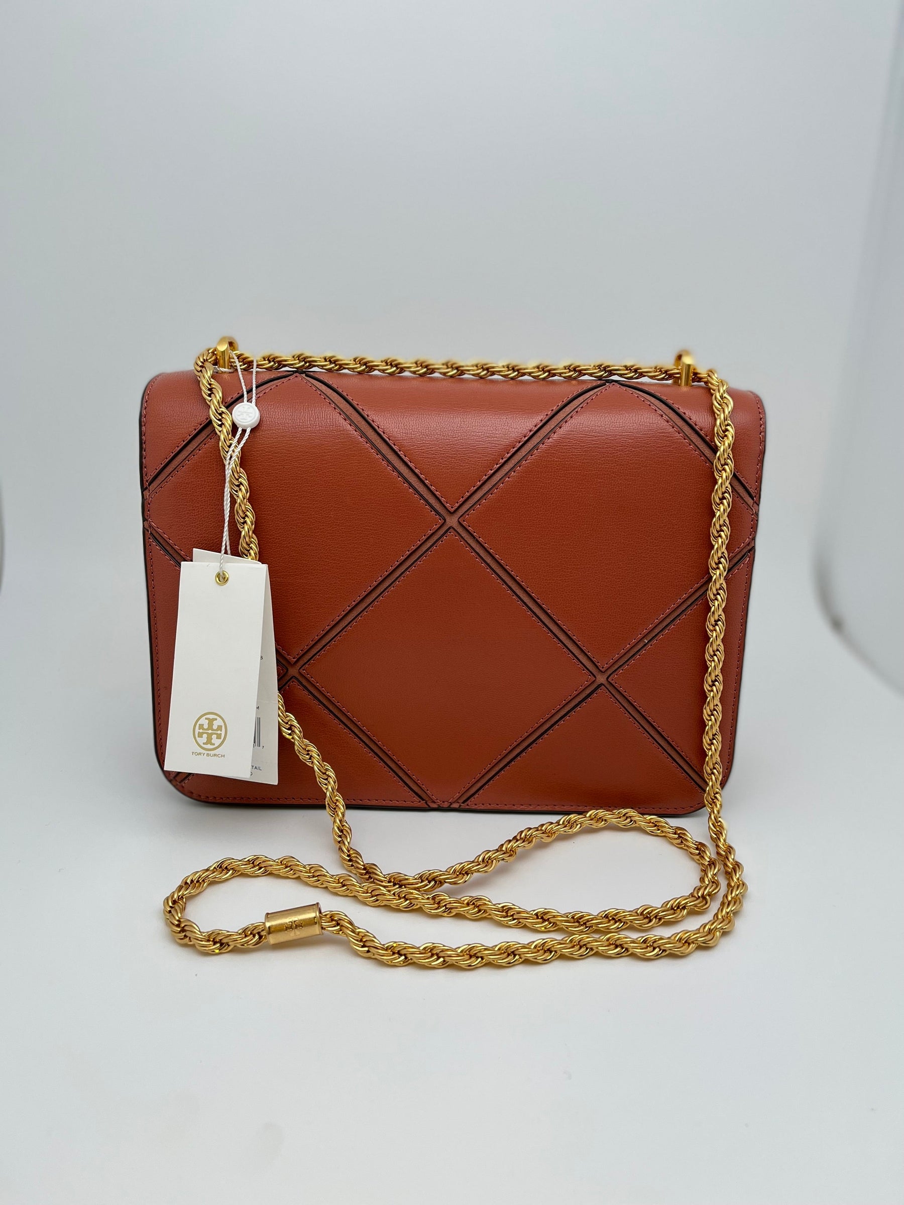 Tory Burch Eleanor Diamond Shoulder Bag with leather and gold toned hardware. Interior pockets and snap closure. New with tags