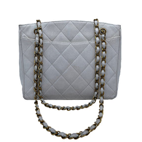 Chanel Vintage Caviar Quilted Turn Lock Open Top Tote  White Caviar Leather   Interlocking CC Turn Lock   Gold Tone Hardware  Chain Link Leather Straps   Two Exterior Flat Pockets   Open Top   Leather Interior   Two Interior Zipper Pockets 