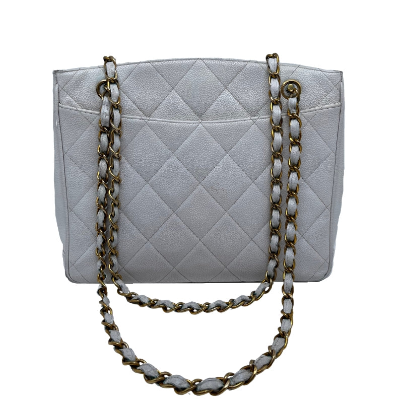 Chanel Vintage Caviar Quilted Turn Lock Open Top Tote  White Caviar Leather   Interlocking CC Turn Lock   Gold Tone Hardware  Chain Link Leather Straps   Two Exterior Flat Pockets   Open Top   Leather Interior   Two Interior Zipper Pockets 