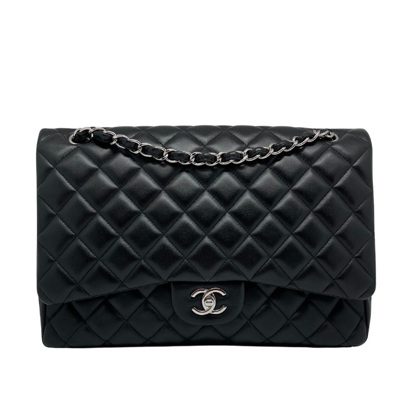 Chanel Maxi Single Flap Bag   Quilted Black Leather Exterior   Leather Threaded Chain-link Shoulder Straps  Silver Toned Hardware  Exterior Flat Pocket   CC Turn Lock Front Flap Closure  Maroon Leather Interior  Interior Flat Pocket   Interior Zipper Pocket 