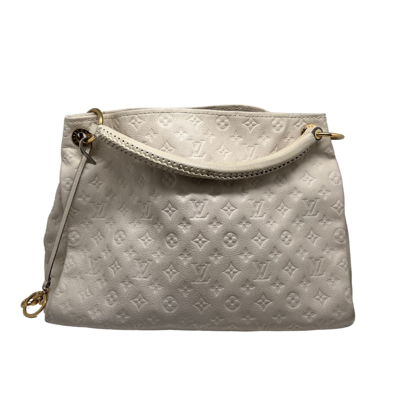 Louis Vuitton Monogram Artsy  Cream Leather Exterior with LV Monogram  Gold Toned Hardware  Open Top   Rolled Handel with Braided Detail  Navy and Cream Stripped Fabric Interior   Six Interior Flat Pockets   1 Interior Flat Zipper Pocket 