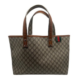 Gucci GG Supreme Tote Bag  Monogram Canvas Exterior   Gold Toned Hardware  Two Exterior Shoulder Straps  Brown Leather Detailing on Exterior   Green and Red Fabric Tag on Exterior    Cream Fabric Interior   Single Interior Pocket with Monogram Canvas Exterior
