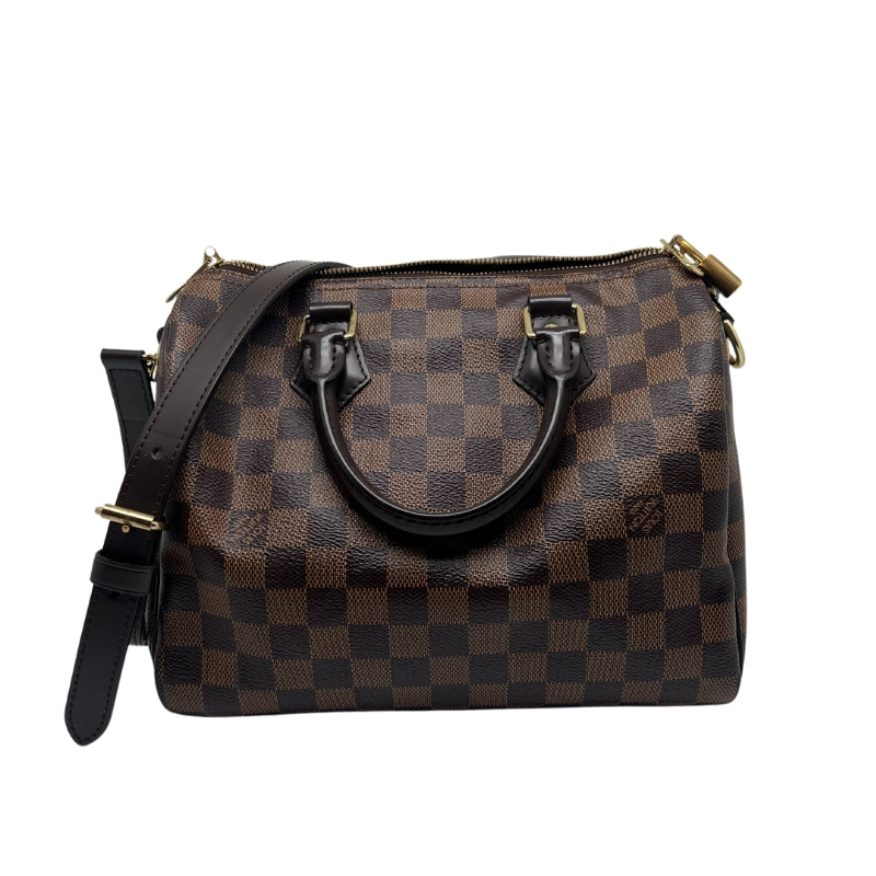 Louis Vuitton Speedy Bandoulière MM  Damier Canvas Exterior   Gold Toned Hardware  Double Brown Leather Handles  Single Removable and Adjustable Shoulder Strap   Zip Closure with Lock and Key   Red Fabric Interior   Single Interior Flat Pocket with Zip Closure 