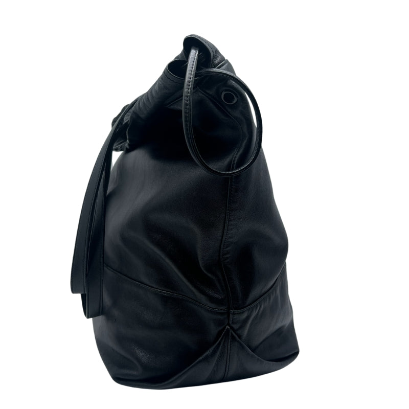 Saint Laurent Drawstring Tote Bag  Black Leather Exterior   Drawstring Closure on Top Exterior   Double Leather Shoulder Straps  Black Fabric Interior   Wallet Attached to Interior 
