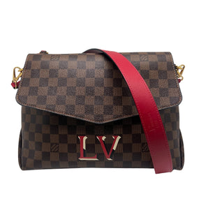 Louis Vuitton Damier Ebene Beauborg MM  Monogram Canvas Exterior   Gold Toned Hardware  Removable Flat Red Leather Shoulder Strap   Removable Flat Strap Top Handle   Removable Tag Accent on Top Exterior   Single Exterior Flat Pocket with Red Suede Interior   LV Monogram Accent on Front Exterior   Envelope Flap Opening   Single Button Closure   Red Suede Interior   Single Interior Flat Pocket 