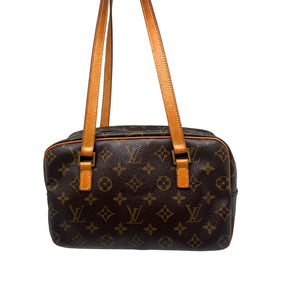 Louis Vuitton Monogram Cite MM Bag  Monogram Canvas Exterior   Gold Toned Hardware  Double Shoulder Straps  Double Zip Closure on Exterior   Brown Leather Interior   Triple Interior Flat Pockets 