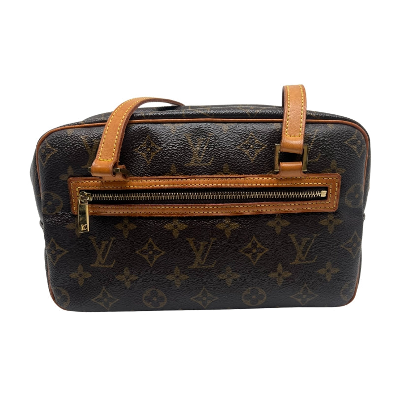 Louis Vuitton Monogram Cite MM Bag  Monogram Canvas Exterior   Gold Toned Hardware  Double Shoulder Straps  Double Zip Closure on Exterior   Brown Leather Interior   Triple Interior Flat Pockets 