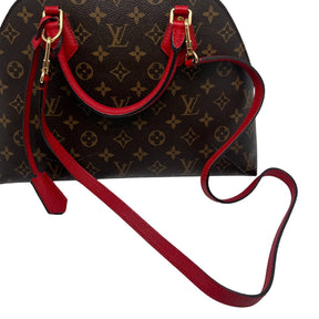 Louis Vuitton BNB Alma Monogram Bag  Monogram Canvas Exterior   Gold Toned Hardware  Double Rounded Red Leather Straps   Removable Flat Red Shoulder Strap  Red Tag Accent on Exterior   Single Zip Closure   Red Leather Exterior Surrounding Zipper   Red Suede Interior   Single Interior Flat Pocket 