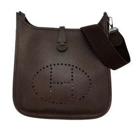 Hermes Clemence Evelyn chocolate brown, leather exterior, single adjustable shoulder strap, suede interior, laser cut H accent, palladium plated hardware, single exterior pocket, snap closure at back, front view