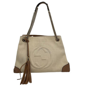 Gucci canvas soho chain tote, beige canvas exterior, chain dual shoulder strap, brown leather embellishments, brown leather tassel, silver tone hardware, GG logo stitched on front, canvas lining, three interior pockets, top clasp closure, condition good, front view