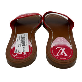Louis Vuitton Monogram Escale Slides with red and pink, brown leather soles, white stitching. Excellent condition