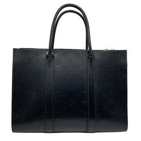 Louis Vuitton Very Monogram Tote   Monogram Black Leather  Gold Toned Hardware   Rolled Leather Handles   Removable Shoulder Strap  Includes Lock, Key, and Clochette   Alcantara Interior Lining   One Zip Top Closure  Two Open Top Compartments   Protective Feet   Dust Bag Included 