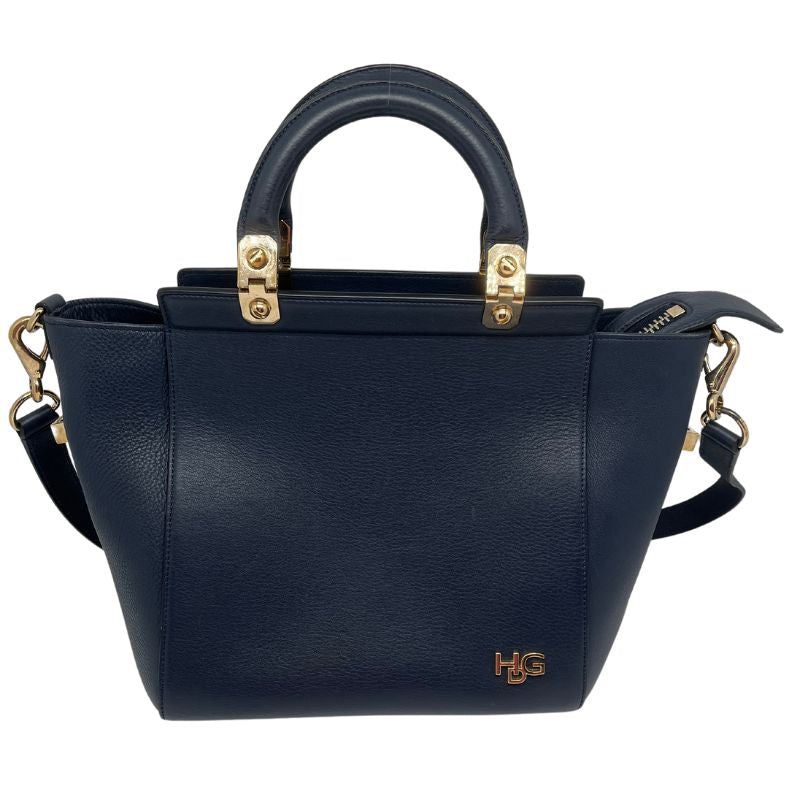 Givenchy HDG Leather Tote with navy leather, gold tone hardware, flat handles, single shoulder strap, suede lining, three interior pockets, zip closure at top. Great condition