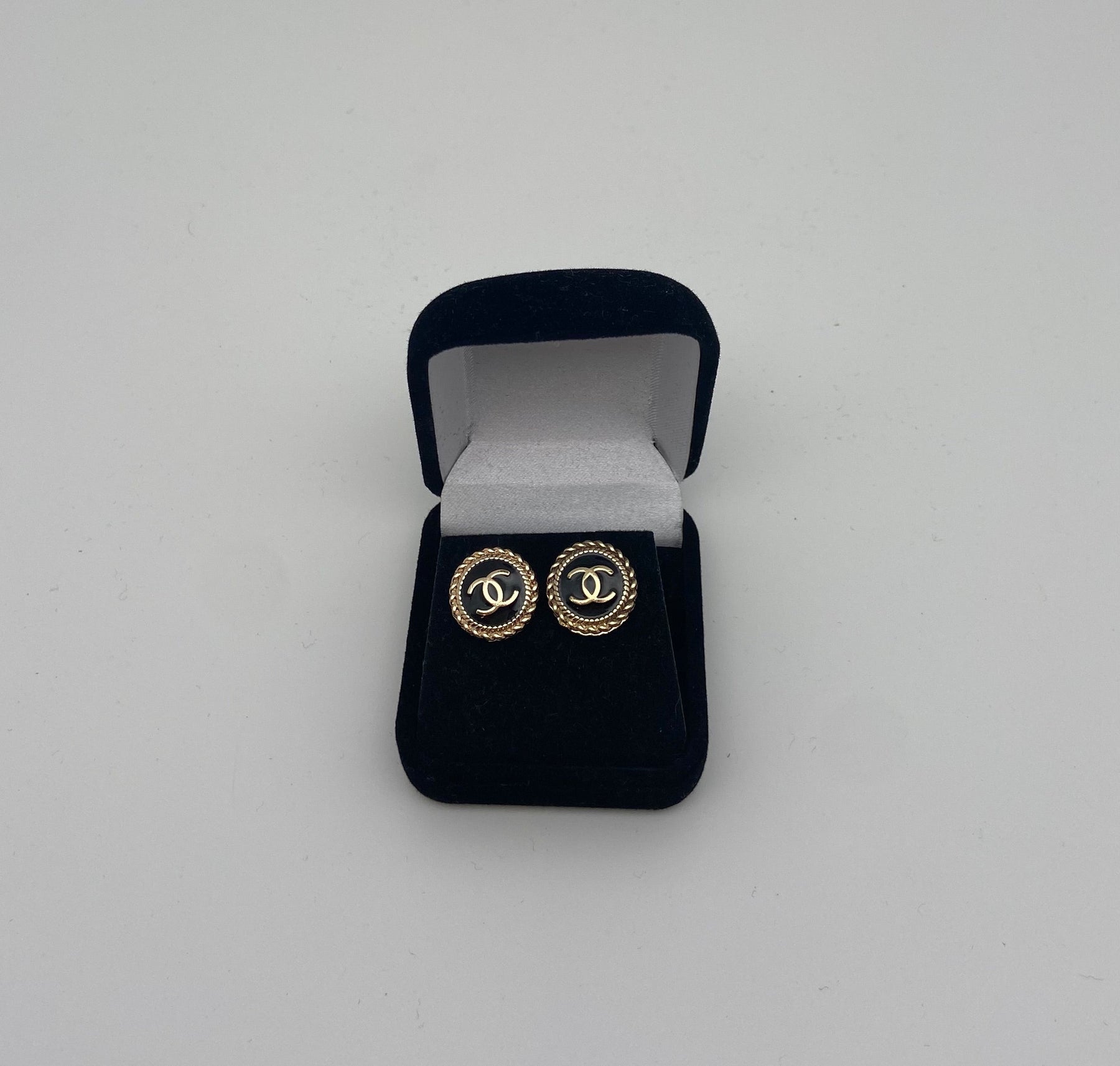 Black and gold Chanel button earrings